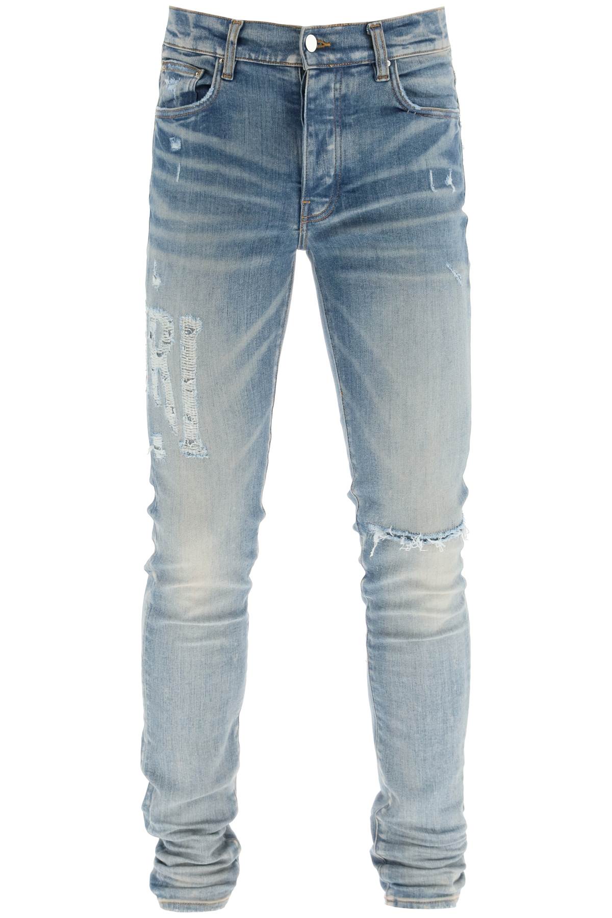 Amiri 'distressed logo' jeans